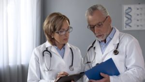 Medical colleagues conferring over patient records